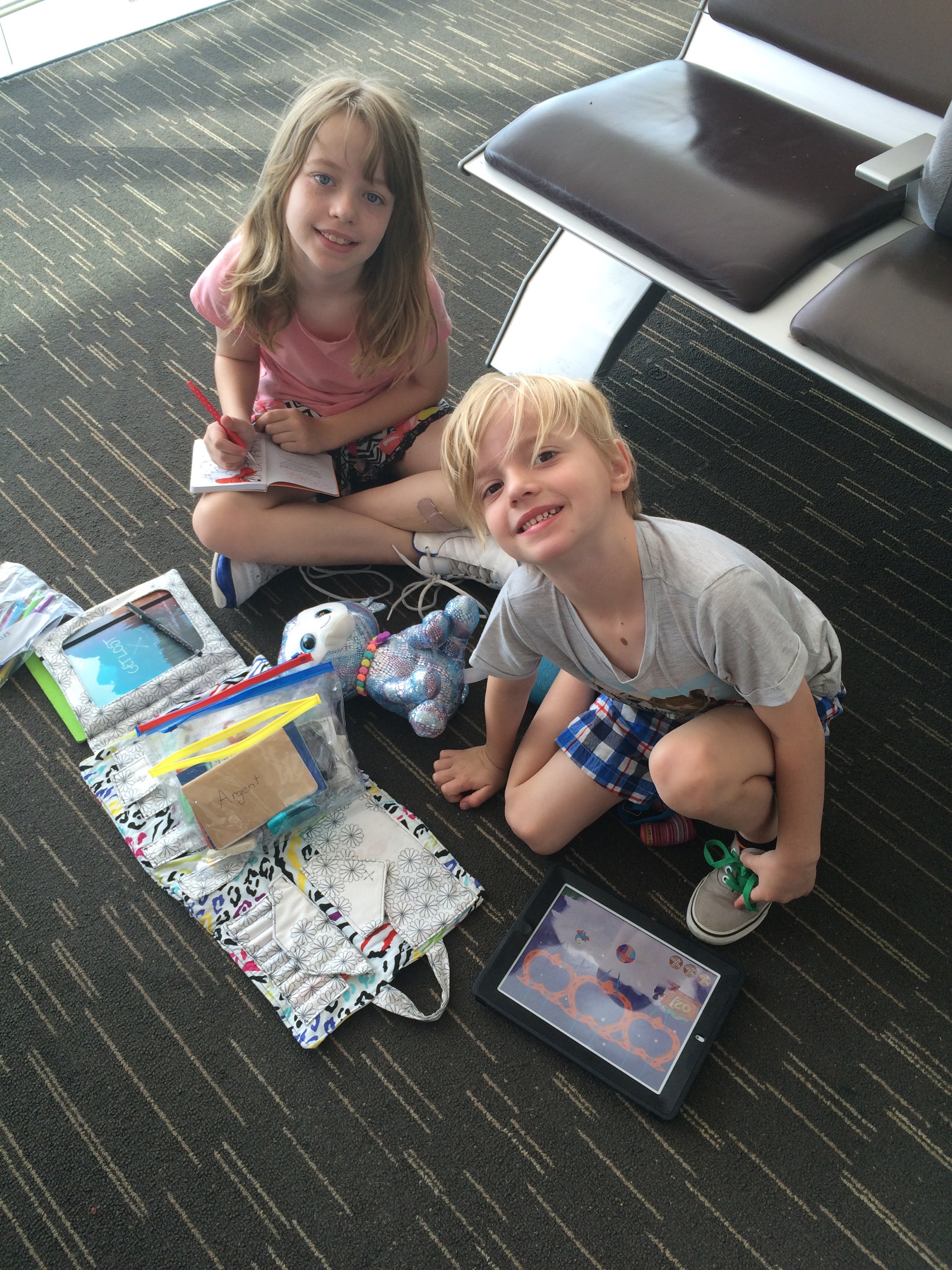 ArgeyKids on the floor of Sydney Airport, waiting for the flight to Dubai