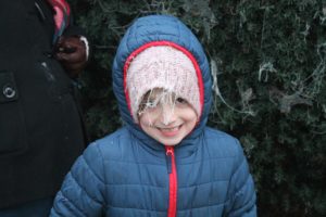 ArgeySon hanging a frozen spider web over his beanie.