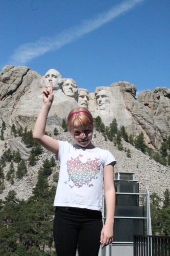 A fun (if slightly disrespectful) selfie at Mount Rushmore - Picking the nose of George Washington.